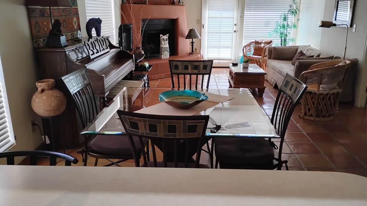 Living and dining room of a Tucson home kept on a recurring cleaning schedule