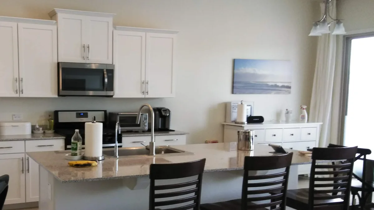 Bright kitchen with a clean island and cleared counters
