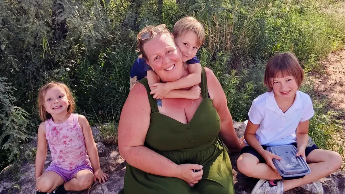 Audrey Talbert, owner of Green Guru Cleaning, with her kids in the Tucson desert