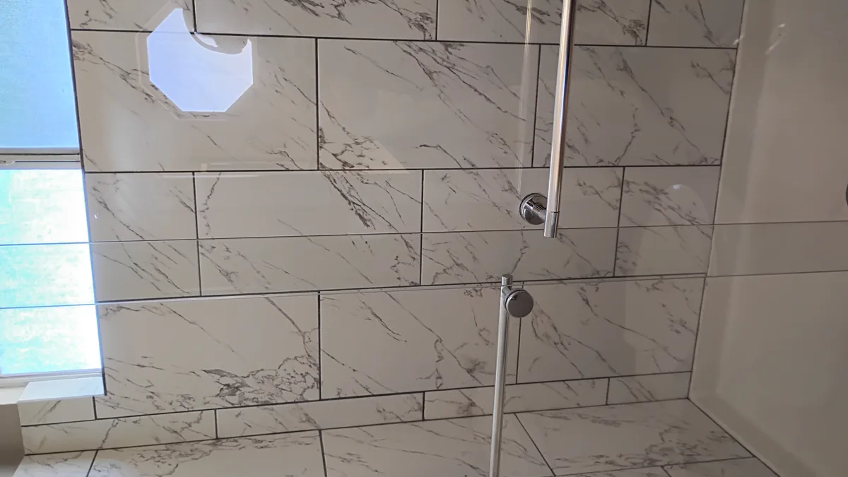 Marble tiled walk-in shower cleaned in a Tucson home